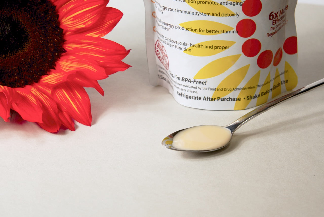 Lipo Naturals Liquid Liposomal Supplement in a spoon